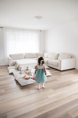 Screen Free Play, Little Girl Engaged with Toys in Minimalist Montessori Home