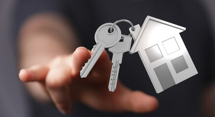 Close-up of hand offering keys with house keychain, symbolizing homeownership, real estate, mortgage and buying a house