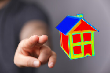 A hand pointing to a 3D model house with colorful gradient, symbolizing real estate, investment, and the concept of home.