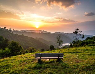 Bench on a hill overlooks mountains at sunset, vibrant colors