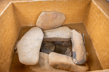 A view of stone slabs covering an archaeological burial site at San Agustin, showcasing pre-Columbian art and history in Colombia.