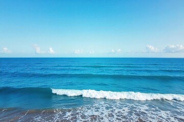Breathtaking Panoramic Ocean View Azure Waters Meet Horizon, Gentle Waves on Sandy Shore. Ideal for travel, nature, and marine projects. Evokes serenity and escape.