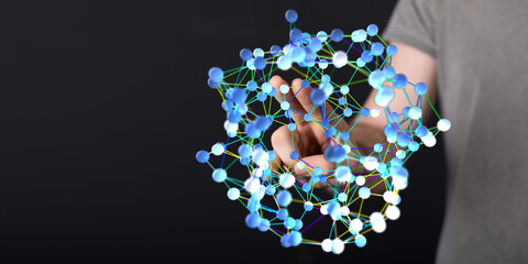 Human hand interacting with a 3D rendering of a digital network, showcasing technology connection...