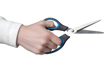 A hand holding open decorative edge scissors with black and blue handles on transparent background
