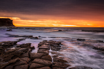 Tesselated rocks ocean sunrise Garie Australia © Leah-Anne Thompson