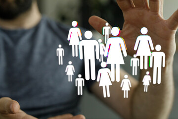 Naklejka na ściany i meble Abstract image of a person holding up digital human figures, representing community, concept of protecting people, diversity.