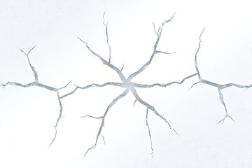 Fractured white surface with radiating, branch-like cracks