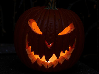 Abstract dark illustration featuring a stylized face with a single eye, evoking a feeling of...