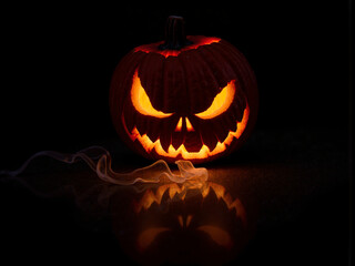 Abstract image with a glowing orange sphere, evocative of Halloween or a stylized jack-o'-lantern