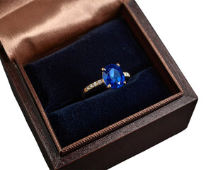 Hand Holding Shining Light Bulb with Energy Rays, Creative Concept, isolated - Open Jewelry Box Displaying Blue Gemstone Ring, Top-Down Perspective, isolated