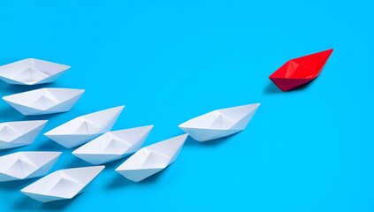 Naklejka premium Red Paper Boat Leading White Paper Boats on Blue Background
