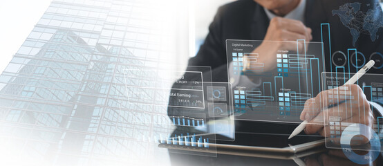Businessman using digital tablet analyzing sales data and financial growth graph chart report, online marketing plan. Business strategy and development. Market research, data analysis
