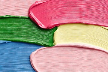 Strokes of pink, blue, yellow, and green paint textures abstractly