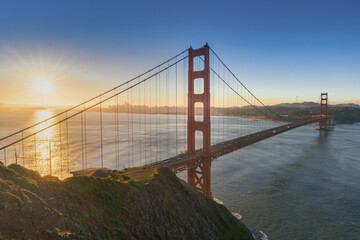 Beautiful scene of famous Red Golden Gate Bridge and sunlight in the morning. Golden Gate Bridge, San Francisco, California, USA.