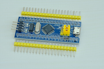 Programming board of Arduino UNO in blue colour isolated in white background