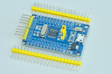 Programming board of Arduino UNO in blue colour isolated in white background