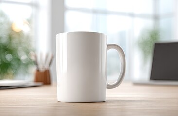 Fototapeta premium Plain white ceramic mug on a wooden desk with a blurred bright office background