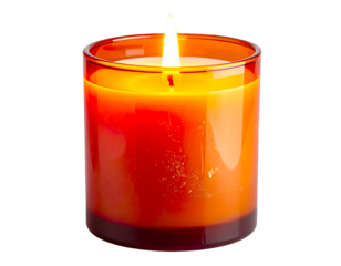 Yellow ochre candle burning inside a vintage glass container with warm ambient light and soft flame