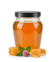 Oval Shaped Glass Jar of Orange Blossom Honey with matte cap without label area and surrounded by fresh orange blossom flower, honeycomb and leaves