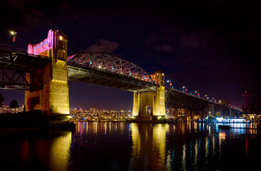 Fototapeta premium Burrard Street Bridge. Nightview of Vancouver from False Creek. Illuminated downtown of Vancouver at night. Vancouver, BC, Canada