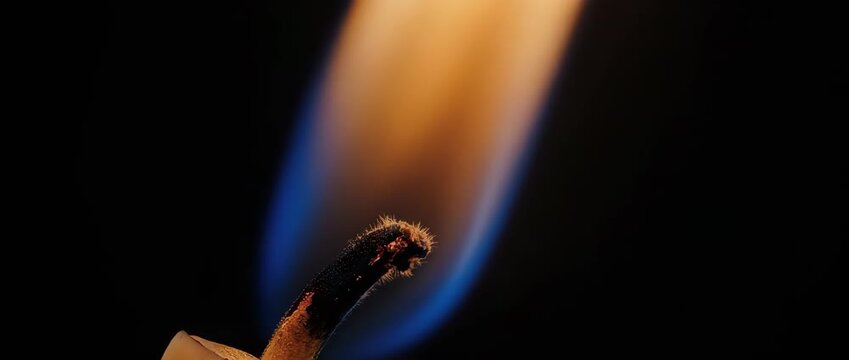 A beautiful macro slow-motion shot of a candle flame. The different temperature zones and invisible convection currents are made visible in this scientific view.
