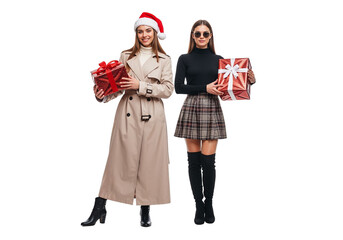 Two Women in Festive Outfits Holding Christmas Gifts on White Background