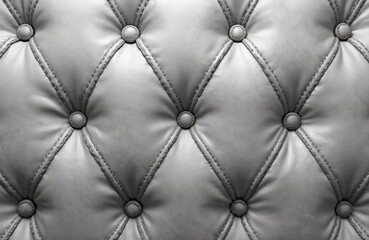 Obraz premium Light grey tufted leather surface with round buttons. Diamond quilted pattern creates elegant textural background. Classic upholstery material ideal for luxury furniture, headboards, walls.