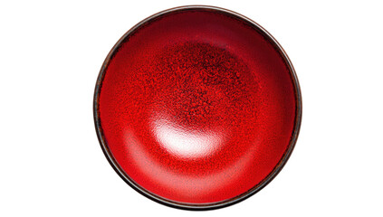 Overhead shot of a deep, round, red ceramic bowl with a glossy finish, against a black backdrop