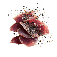 Thinly sliced cured meat, seasoned with black pepper and salt, against a plain black background