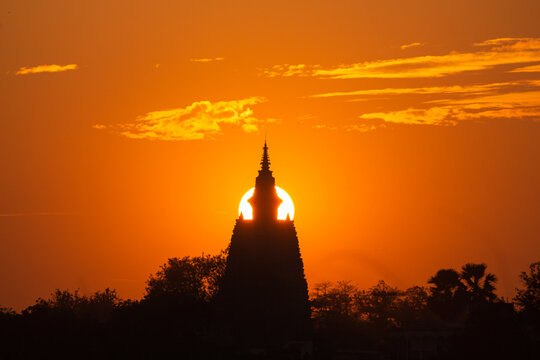 India, Bihar, Bodh Gaya, Beautiful Sunset over the  Sacred Mahabodhi Temple, Sun Going Down Align With Monuments.