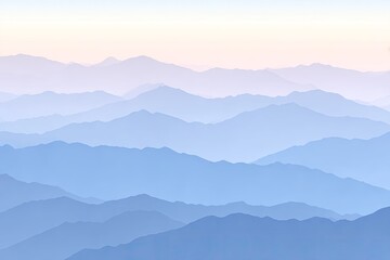 Layered blue mountains receding into soft, light sky
