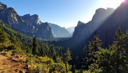 Aerial view of fertile valley with river flowing through green fields and rugged mountains under clear sky for editorial landscape photography agriculture and environmental sustainability-themed visua