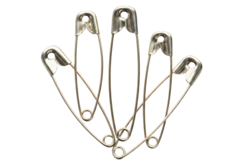 Several metal safety pins fanned out for sewing isolated on a transparent background