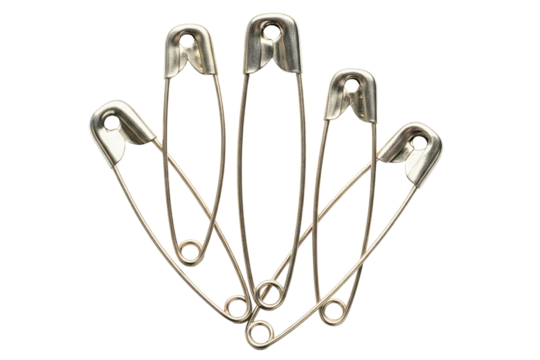 Several metal safety pins fanned out for sewing isolated on a transparent background
