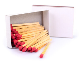 Wooden matches in open matchbox isolated on white background