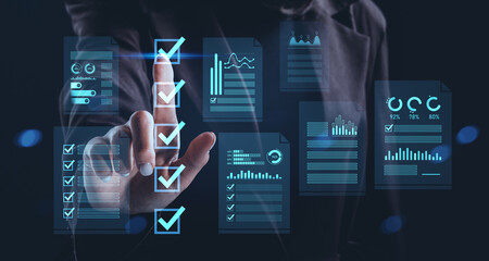 Businessman interacting with digital checklist and data dashboard hologram interface representing futuristic task management concept in blue tones.