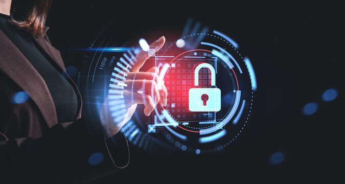 Woman interacting with holographic padlock interface as a cybersecurity concept on dark background with digital data elements and glowing circles.
