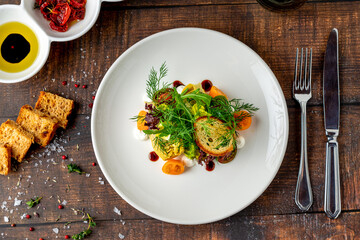 Heirloom tomato salad with grilled squash and fresh herbs