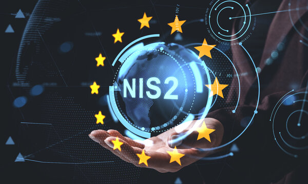 Digital NIS2 cybersecurity concept with holographic Earth and EU stars hovering above a hand on futuristic tech background.