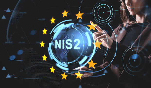 Woman interacting with holographic NIS2 interface surrounded by EU stars and digital graphics, illustrating cybersecurity regulation concept in Europe. - Powered by Adobe