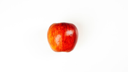 Fresh red apple isolated on white background, showing natural texture and vivid color for healthy food and nutrition concept