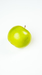 Fresh green apple isolated on white background, captured in a studio to highlight its natural texture and vibrant color.