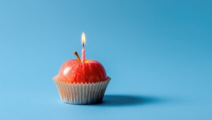 Apple cupcake with lit candle. Bright, fun!