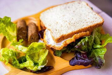 Homemade Vegetarian Sandwich with Lettuce and Vegan Sausage