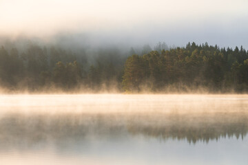 Photography of the lake Bæreia in Kongsvinger, Norway, at sunrise and with a foggy atmosphere.