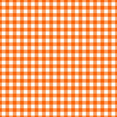 Checkered tablecloth in bright orange and white pattern perfect for picnics and outdoor dining settings