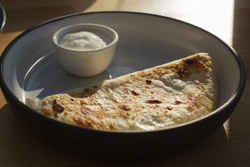 Kystyby is tender mashed potatoes with fried onions in a golden-brown wheat flatbread. National Tatar dish.