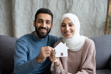 Young Arabian Couple Holds New Home Keys