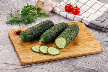 Raw green cucumbers with slices