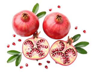 Ripe pomegranates, whole & halved, with seeds & leaves against a dark background